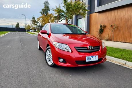 Red 2009 Toyota Corolla Sedan Conquest