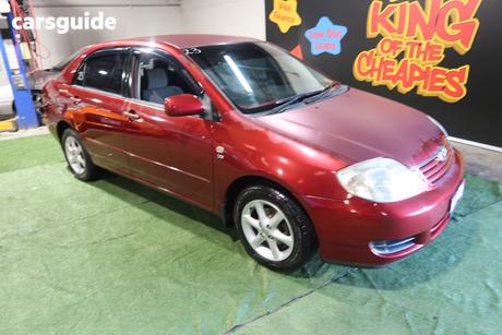 Red 2005 Toyota Corolla Sedan Conquest