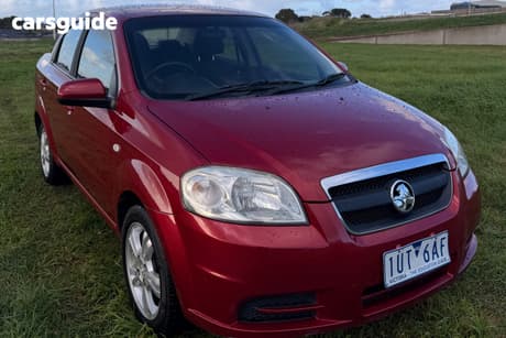 Red 2011 Holden Barina Sedan