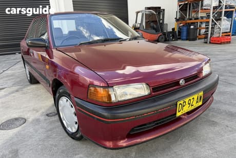 Burgundy 1994 Mazda 323 Sedan