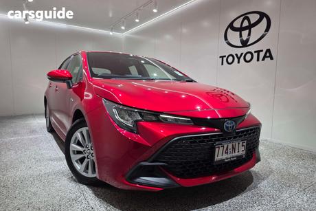 Red 2025 Toyota Corolla Hatchback Ascent Sport Hybrid