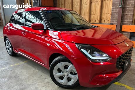 Red 2026 Suzuki Swift Hatchback Hybrid Plus