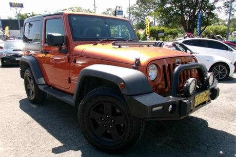 Orange 2011 Jeep Wrangler Softtop Sport (4X4)