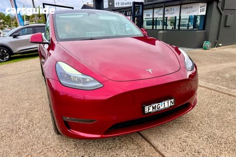 Red 2024 Tesla Model Y Wagon Long Range