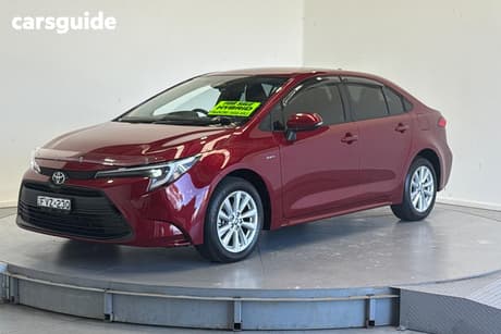 Red 2025 Toyota Corolla Sedan Ascent Sport Hev