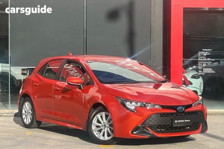 Orange 2025 Toyota Corolla Hatchback Ascent Sport Hybrid
