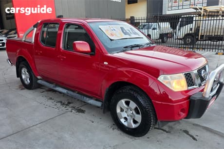 Red 2011 Nissan Navara Dual Cab Pick-up St (4X4)