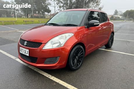 Orange 2013 Suzuki Swift Hatchback Gl