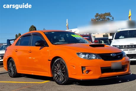 Orange 2012 Subaru Impreza Sedan 2.0I (Awd)