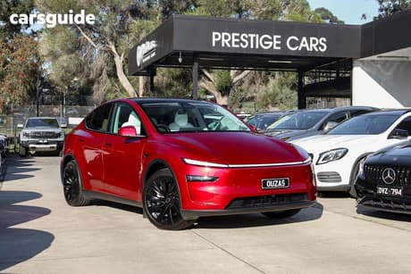 Red 2025 Tesla Model Y Wagon Long Range