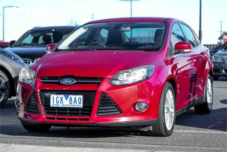 Red 2011 Ford Focus Sedan Sport
