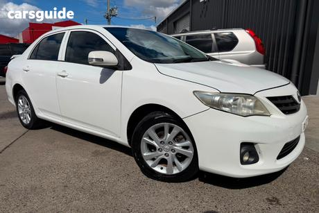 White 2012 Toyota Corolla Sedan Conquest