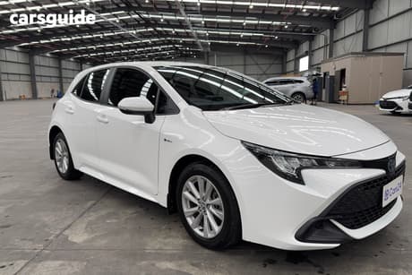 White 2024 Toyota Corolla Hatchback Ascent Sport + Conv Pk Hybrid