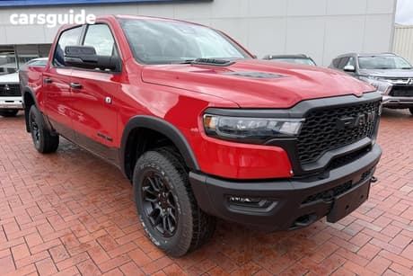 Red 2025 RAM 1500 Crew Cab Utility Rebel Hurricane