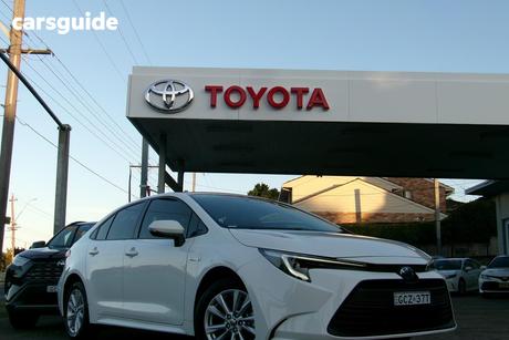 White 2023 Toyota Corolla Sedan Ascent Sport Hybrid