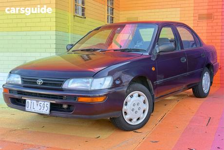 Red 1995 Toyota Corolla Sedan Conquest