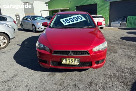 Red 2011 Mitsubishi Lancer Sedan Sx