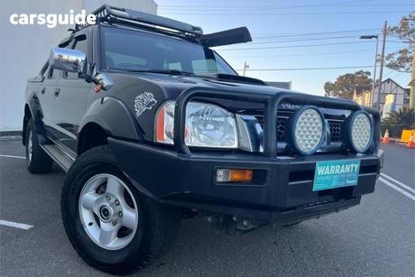 Black 2010 Nissan Navara Dual Cab Pick-up St-R (4X4)