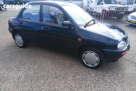 Green 1994 Mazda 121 Sedan