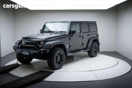 Black 2012 Jeep Wrangler Softtop Unlimited Sport (4X4)