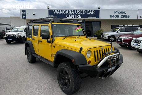Yellow 2009 Jeep Wrangler Softtop Unlimited Sport (4X4)