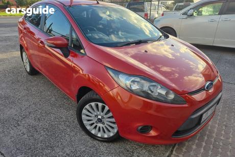 Orange 2010 Ford Fiesta Sedan Lx