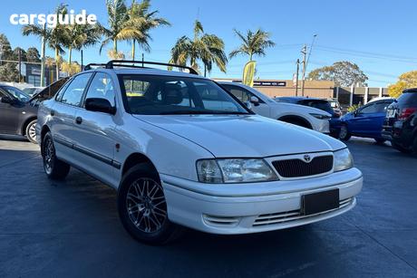 White 2000 Toyota Avalon Sedan Conquest