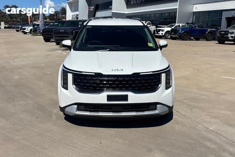 White 2026 Kia Carnival Wagon Sport+ Hev