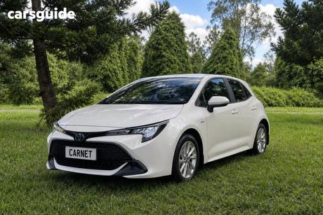 White 2023 Toyota Corolla Hatchback Ascent Sport + Conv Pk Hybrid