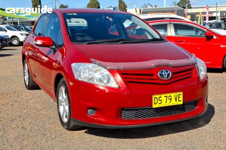 Red 2010 Toyota Corolla Hatchback Conquest