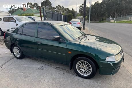 Green 2001 Mitsubishi Lancer Sedan Gli