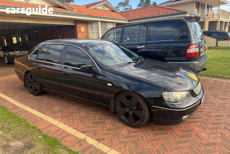 Black 2004 Ford Fairlane Sedan G220