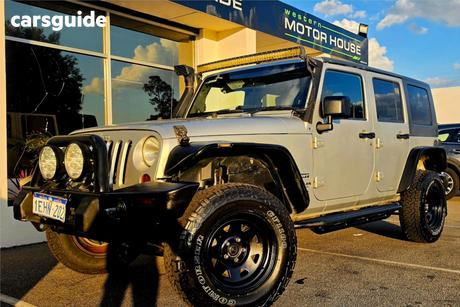 Silver 2010 Jeep Wrangler Softtop Unlimited Sport (4X4)