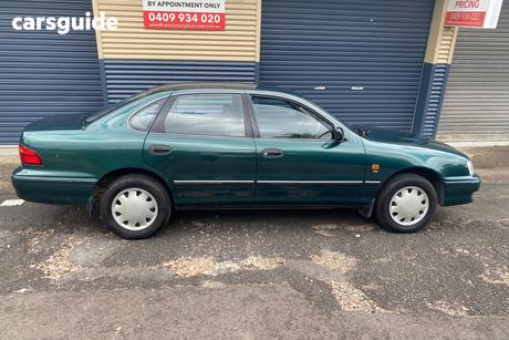 Green 2000 Toyota Avalon Sedan Conquest