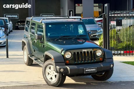 Green 2011 Jeep Wrangler Softtop Unlimited Sport (4X4)