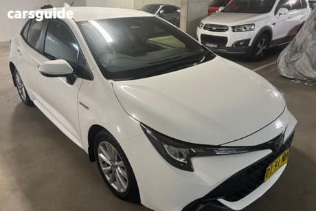 White 2023 Toyota Corolla Hatchback Ascent Sport + Conv Pk Hybrid