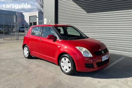 Red 2009 Suzuki Swift Hatchback