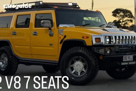Yellow 2003 Hummer H2 SUV