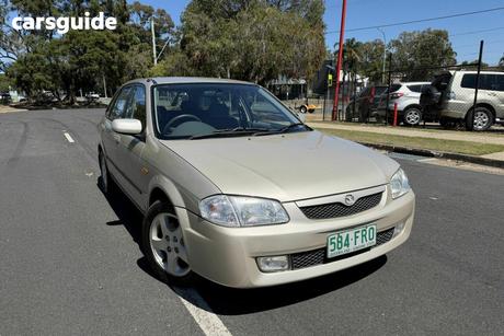 Silver 2000 Mazda 323 Hatchback Astina Shades