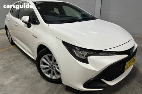 White 2023 Toyota Corolla Hatchback Ascent Sport + Conv Pk Hybrid