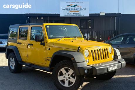 Yellow 2015 Jeep Wrangler Unlimited Softtop Sport (4X4)