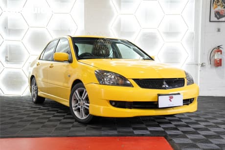 Yellow 2007 Mitsubishi Lancer Sedan Vr-X