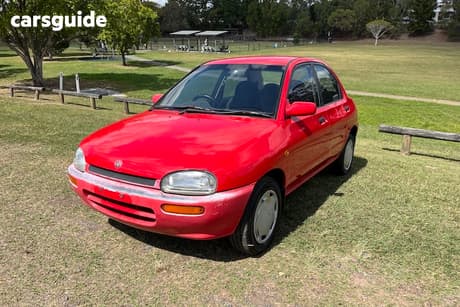 Red 1994 Mazda 121 Sedan