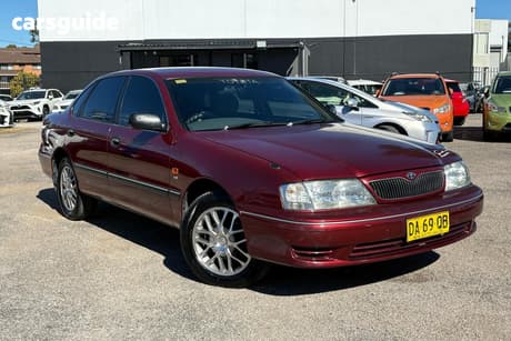 Red 2002 Toyota Avalon Sedan CONQUEST