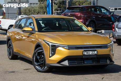 Yellow 2026 Kia K4 Hatchback Sport+