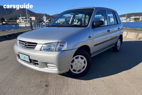 Silver 2002 Mazda 121 Hatchback Metro Shades