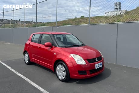 Red 2009 Suzuki Swift Hatchback