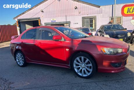 Red 2010 Mitsubishi Lancer Sedan Vr-X