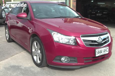 Red 2010 Holden Cruze Sedan Cdx