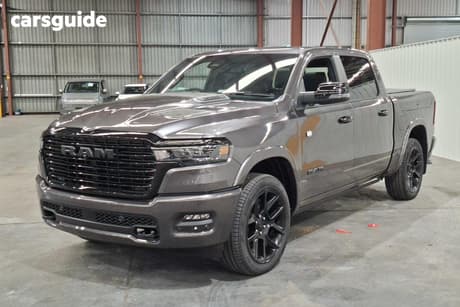 Grey 2026 RAM 1500 Crew Cab Utility Laramie Night Hurricane
